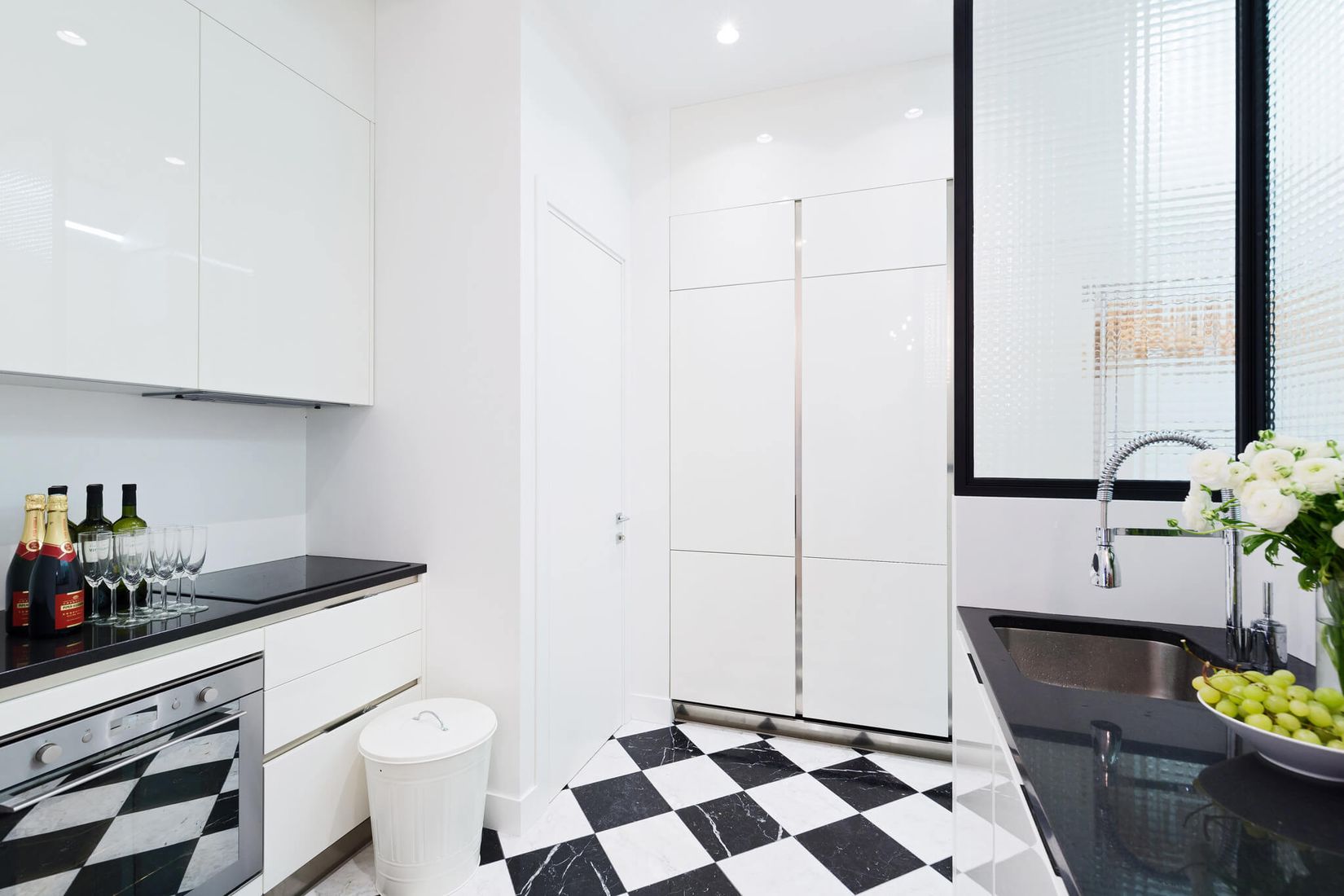 Parisian kitchen with Black and White Checkered Floors via Havenin Saint Honore