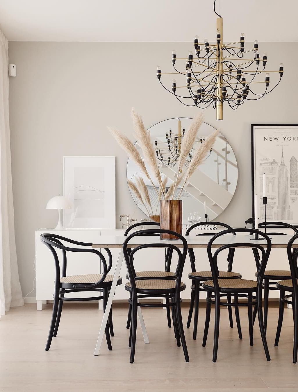 Scandinavian Dining Room with Black Bentwood Dining Chairs via @emmamelins