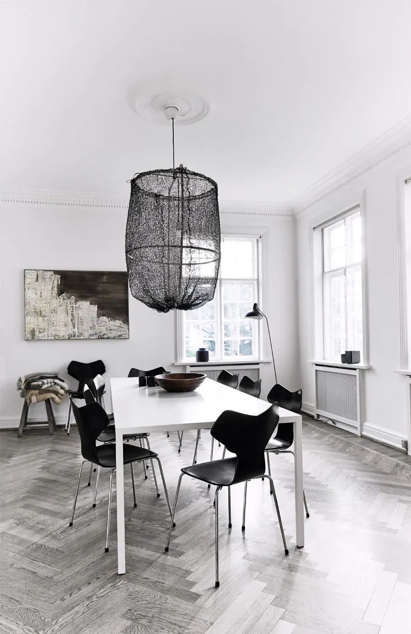 Scandinavian Dining Room with Black Sheer Chandelier via Bo Bedre