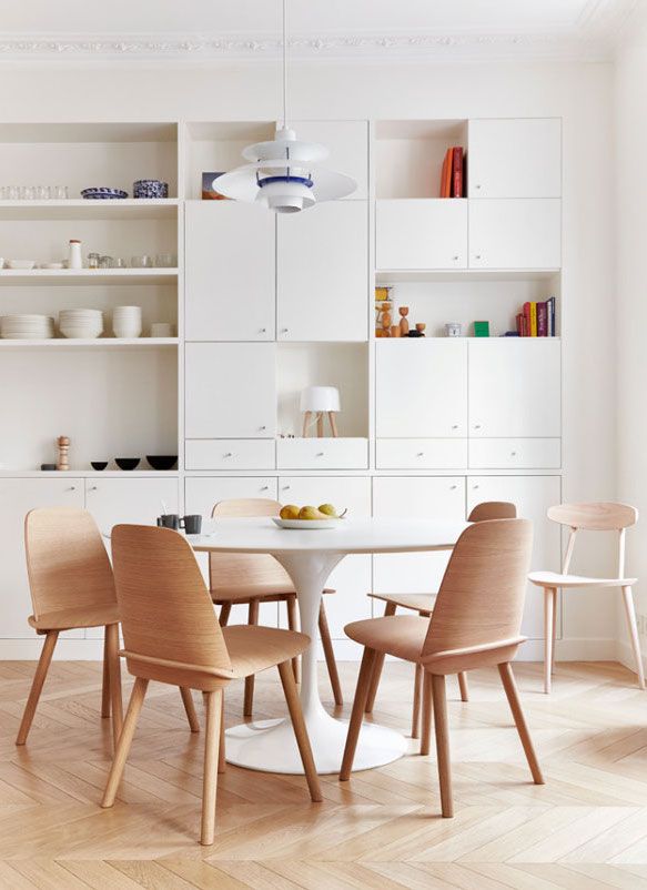 Scandinavian Dining Room with White Built-in Cabinets via Idha Lindhag