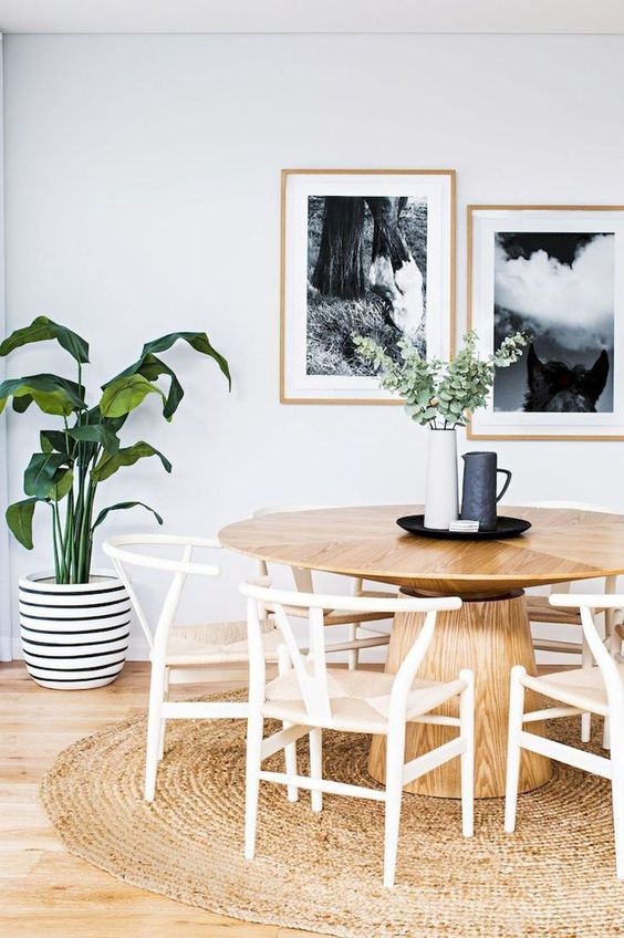Scandinavian Dining Room with White Wishbone Chairs via Greta Hollar