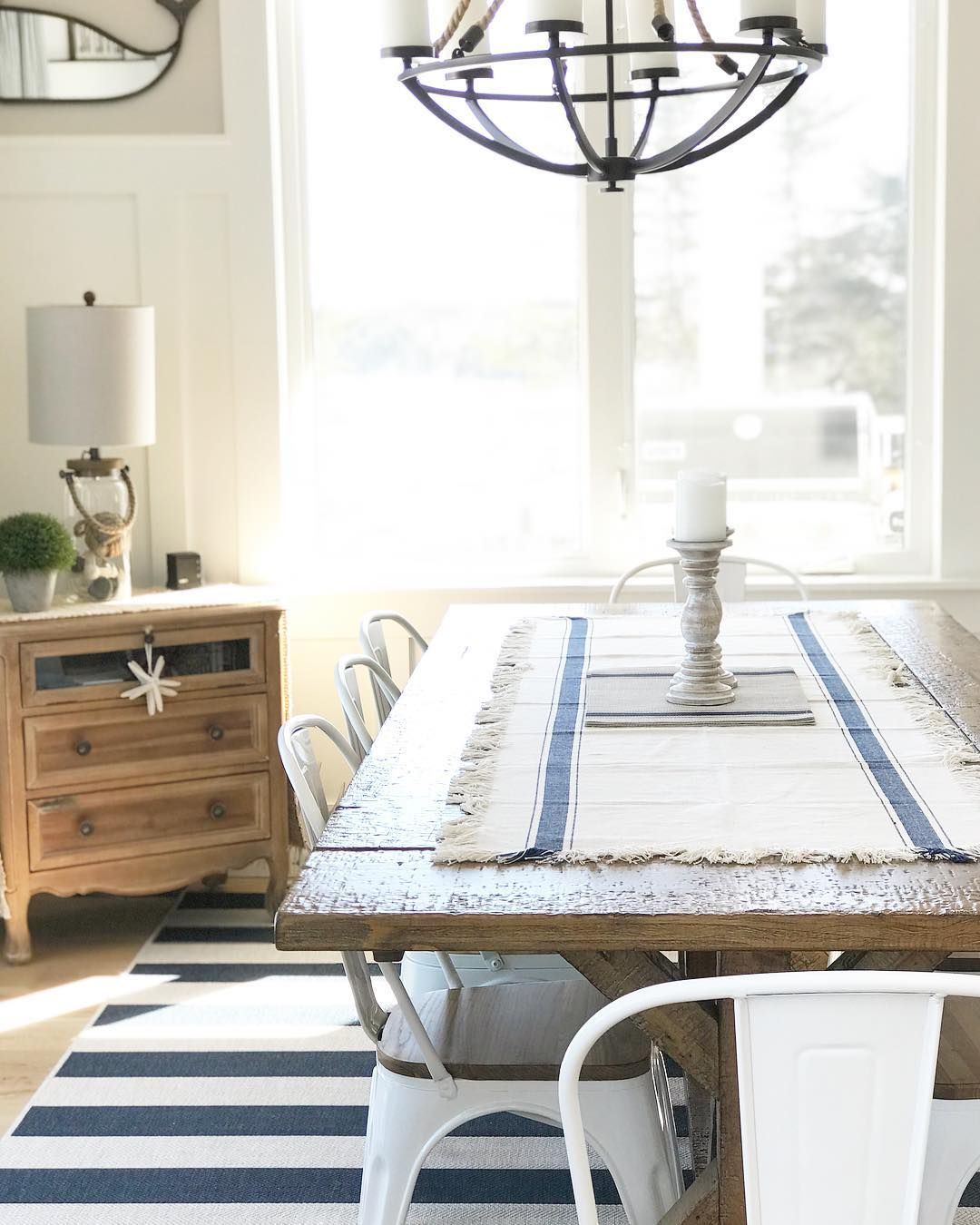 Coastal Dining Room with Blue and White Striped Rug via @kerripopofprettyblog