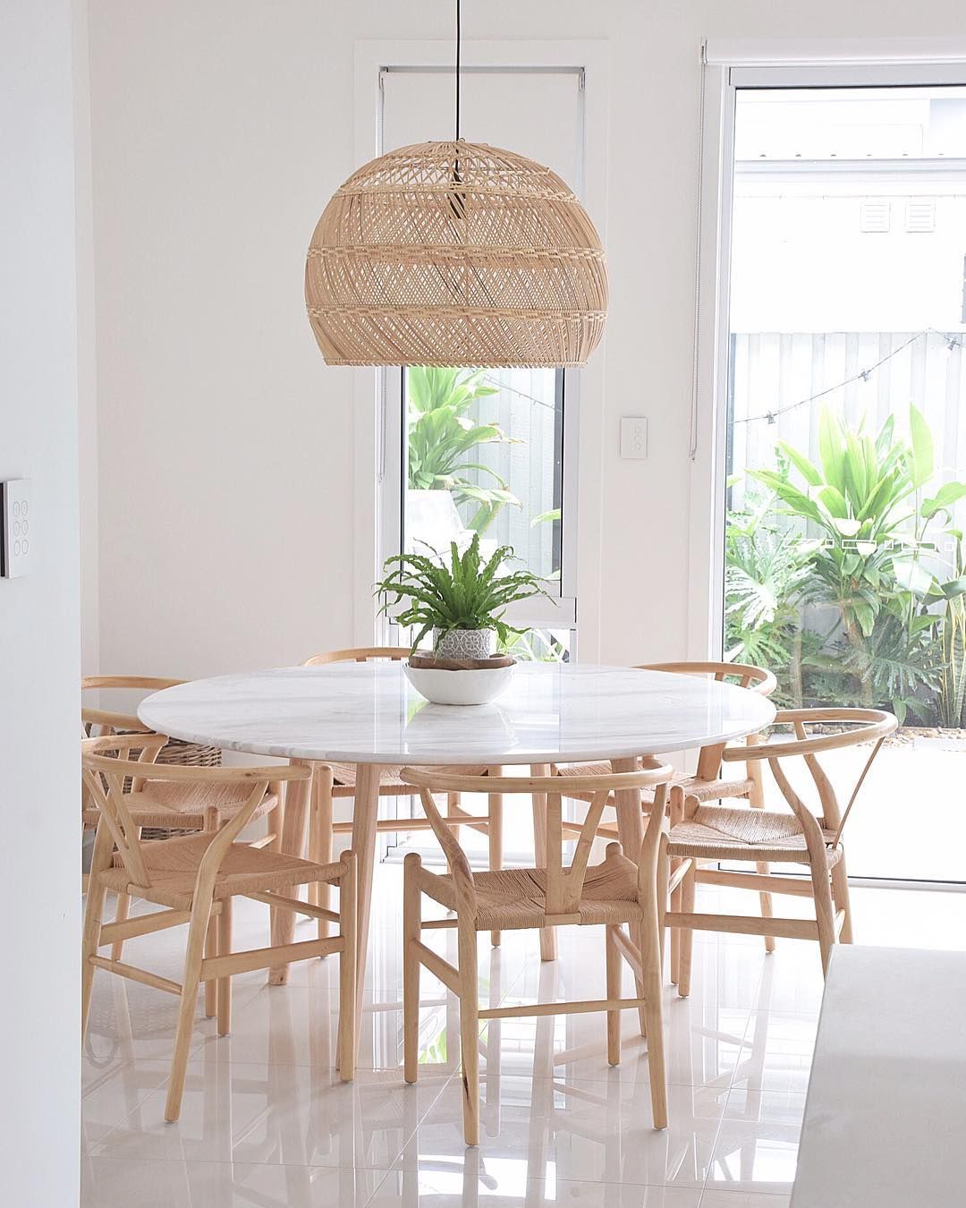 Coastal Dining Room with Minimal white tulip table via @refinendesigns