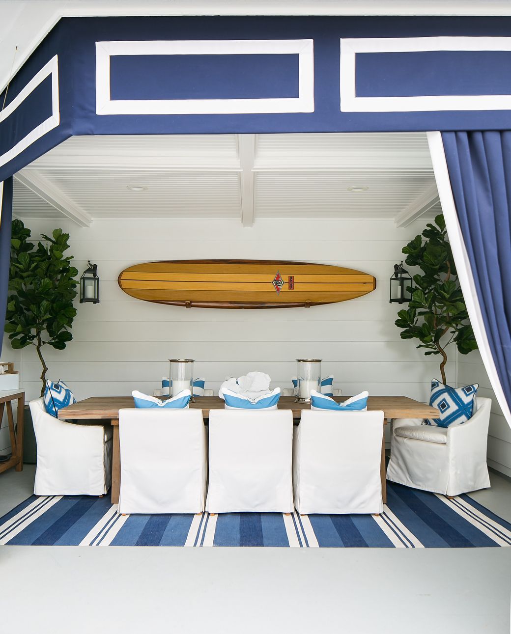 Coastal Dining room with Surfboard on wall via @agk_designstudio