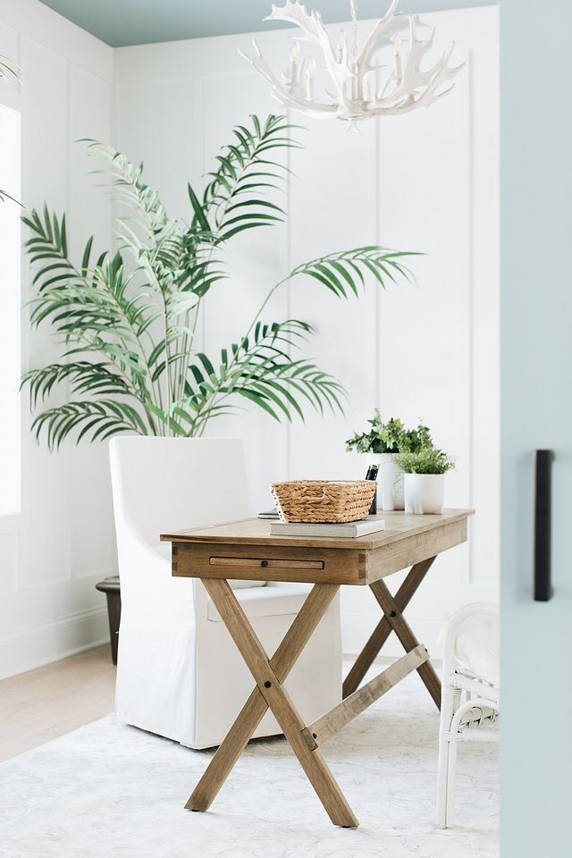 Coastal Home Office with Wood Desk via Timber Trails Development Company