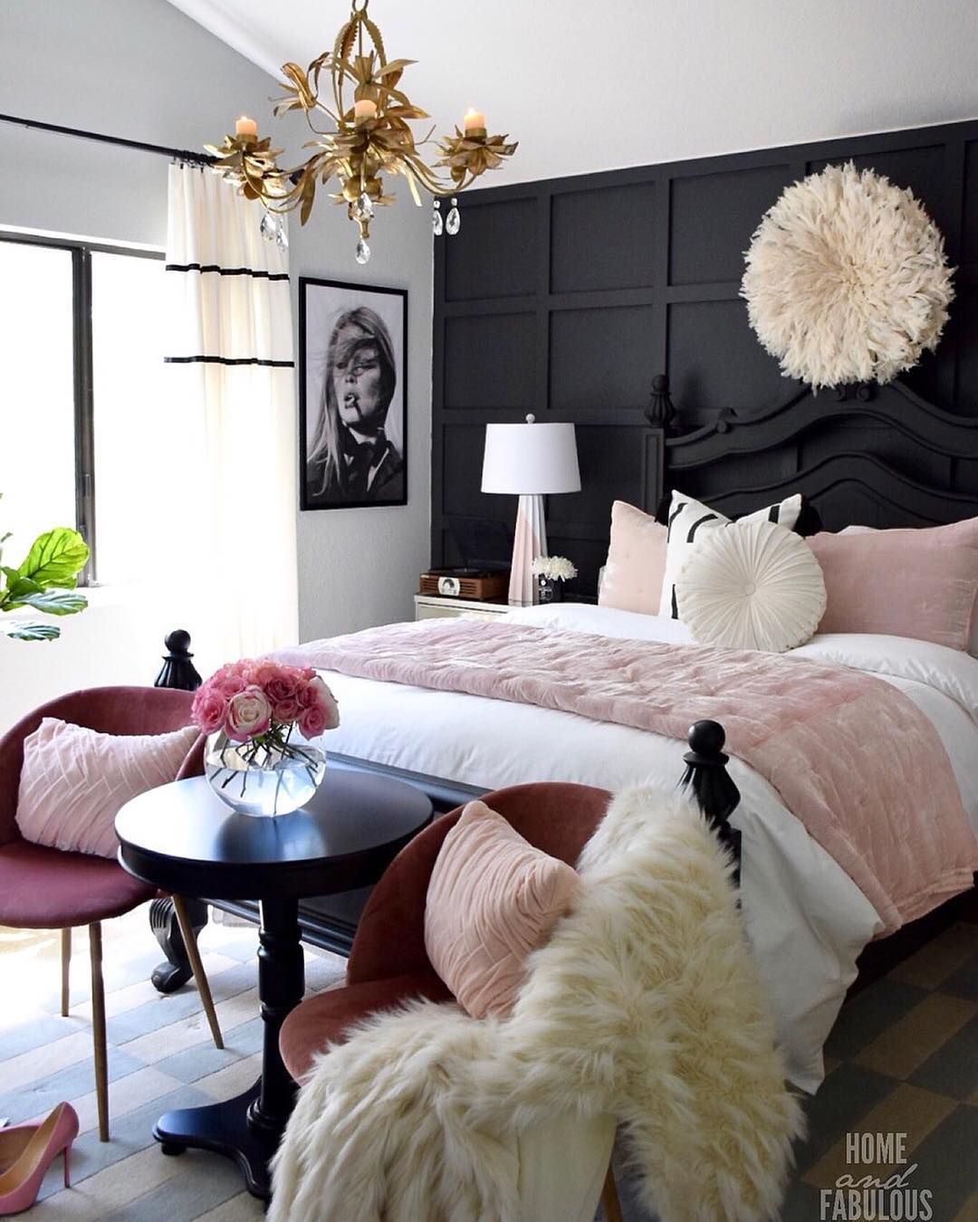 Glam Bedroom with Black wall and headboard gold chandelier and pink accent chairs via @homeandfabulous