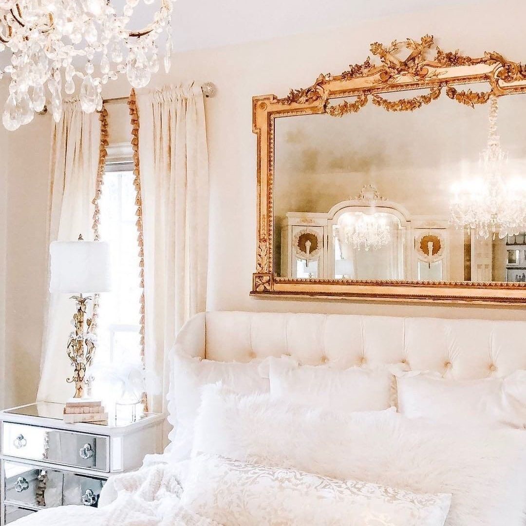 Glam Bedroom with French gold mirror above bed via @ivorylanehome