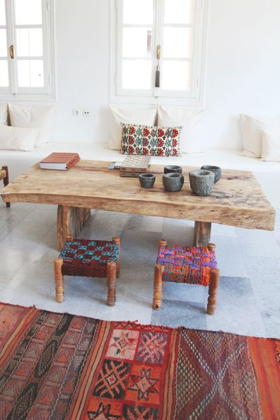Bohemian Dining Room with Live Wood Table and Colorful Stools via perpetually chic