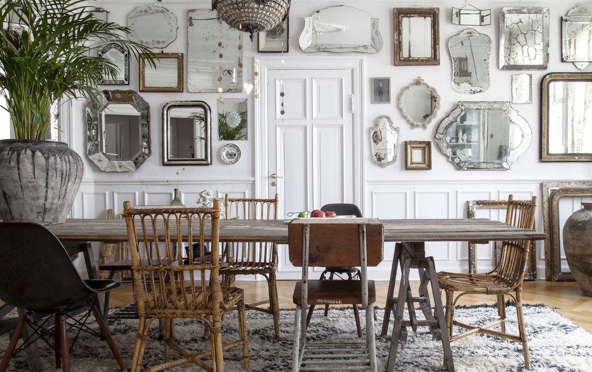 Bohemian Dining Room with Mixed Chairs and Antique Mirror Gallery wall via Iben & Niels Ahlberg