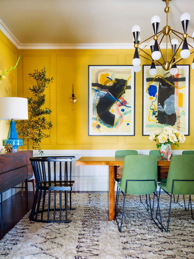 Bohemian Dining Room with Yellow Accent Wall via Dabito and Domino