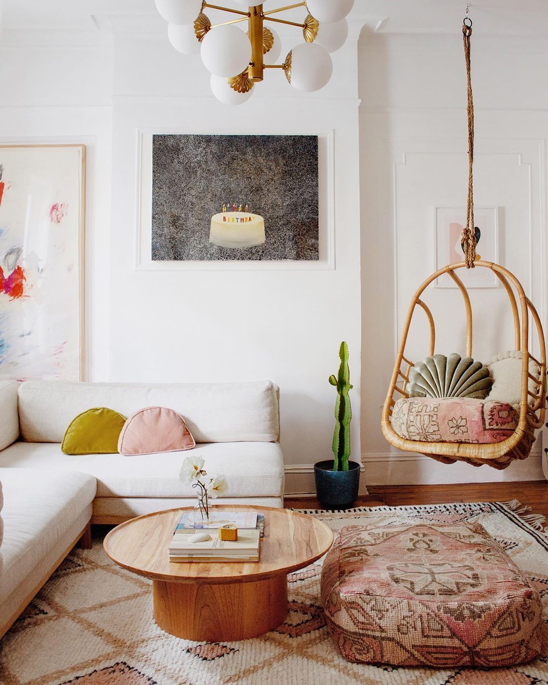 Bohemian Living Room with Rattan Hanging Swing Chair via @reserve_home