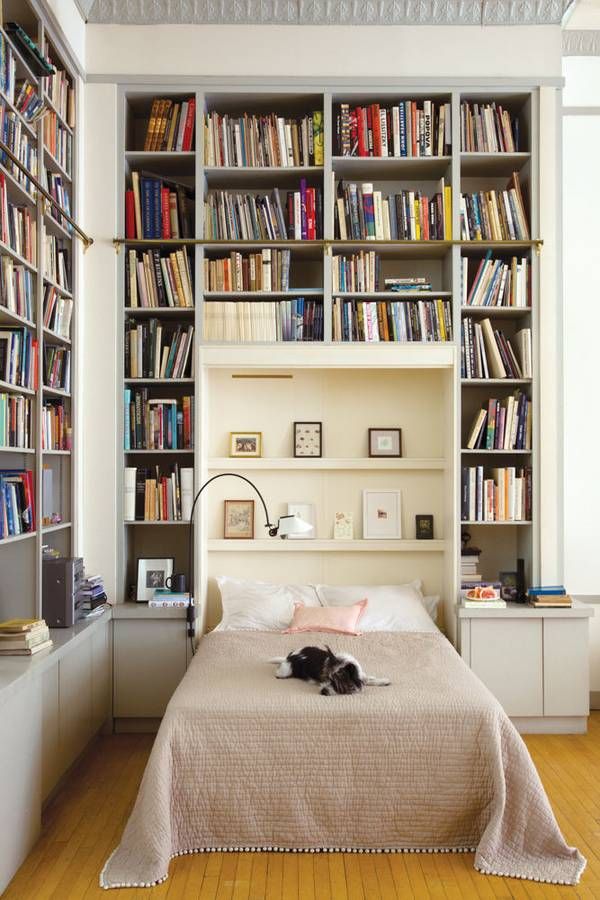 Built-in Bookshelves Surrounding the Bed via Domino Joana Avillez