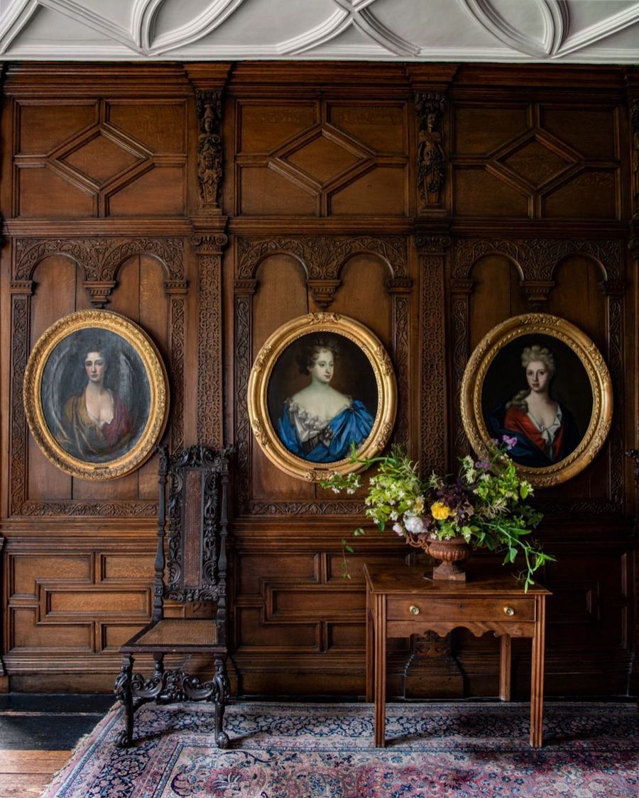 Dark wood walls and side table at Burton Agnes Hall via @acroterium_