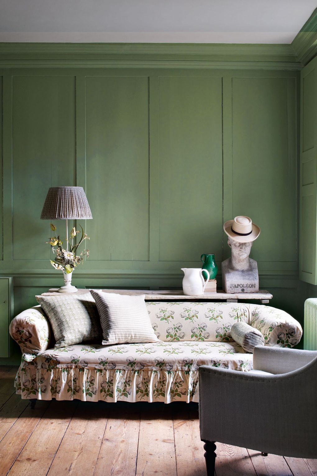 English Country Slipcover Sofa - Colefax and Fowler Bowood print slipcovered sofa with ruffle skirt and Farrow and Ball Green Painted Wall