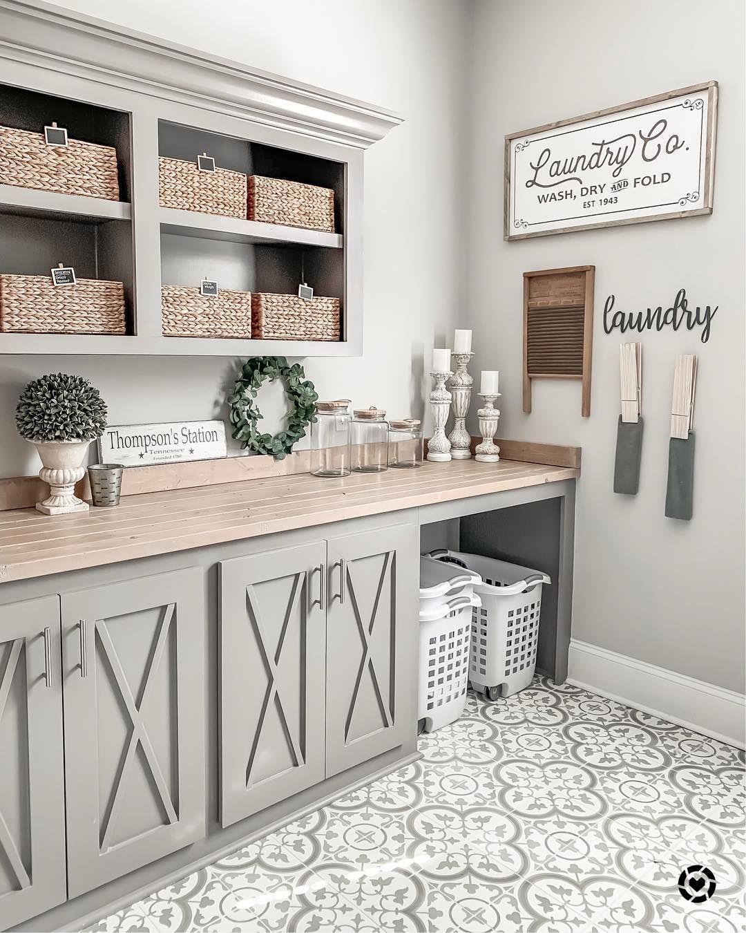Farmhouse Laundry Room with Woven Baskets and Barn Cabinets via @the_lifestyleloop