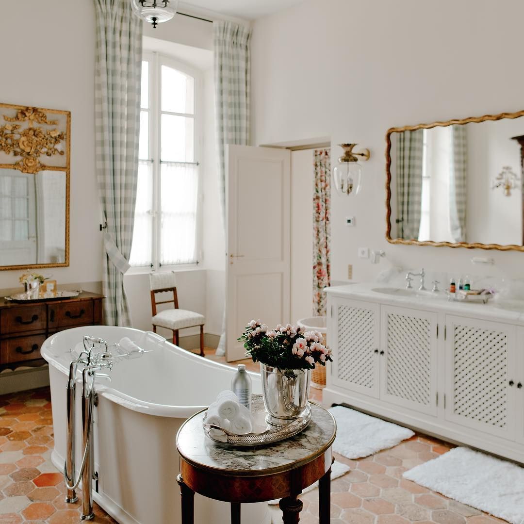 French Country Bathroom with Tub and Antique Marble Side Table via @provencepoiriers