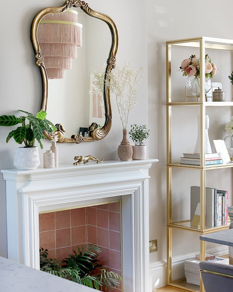 Glam Living Room Decor with Gold Metal Bookshelf via @swoonworthyblog