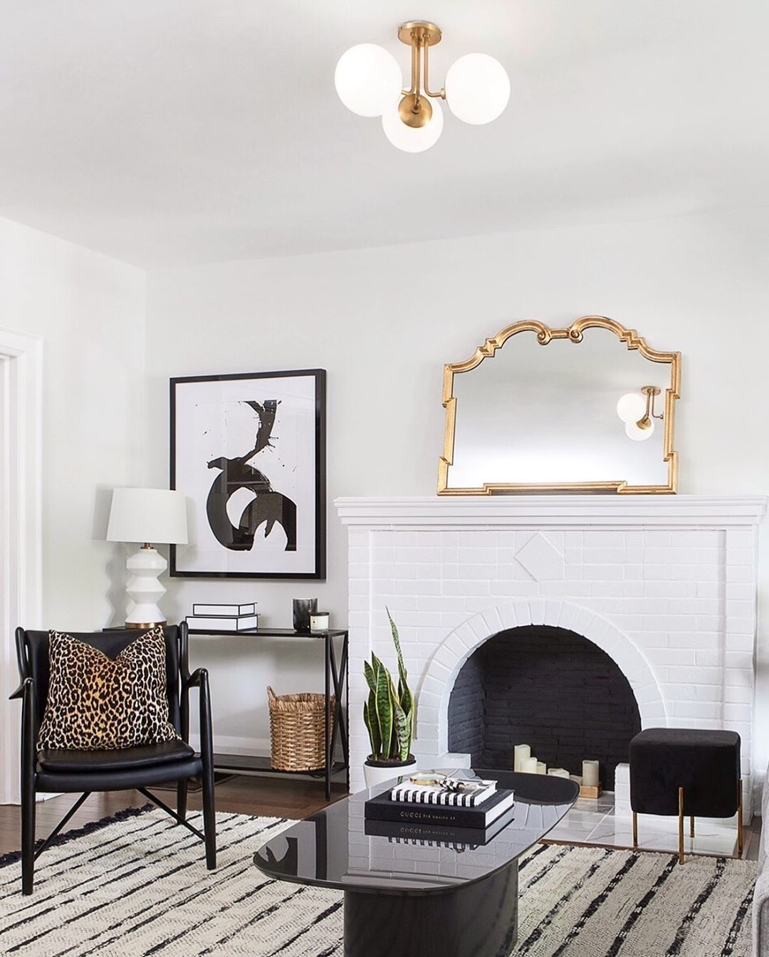 Glam Living Room with Gold Mirror via @kielyramosphoto and Joey Vogel Design