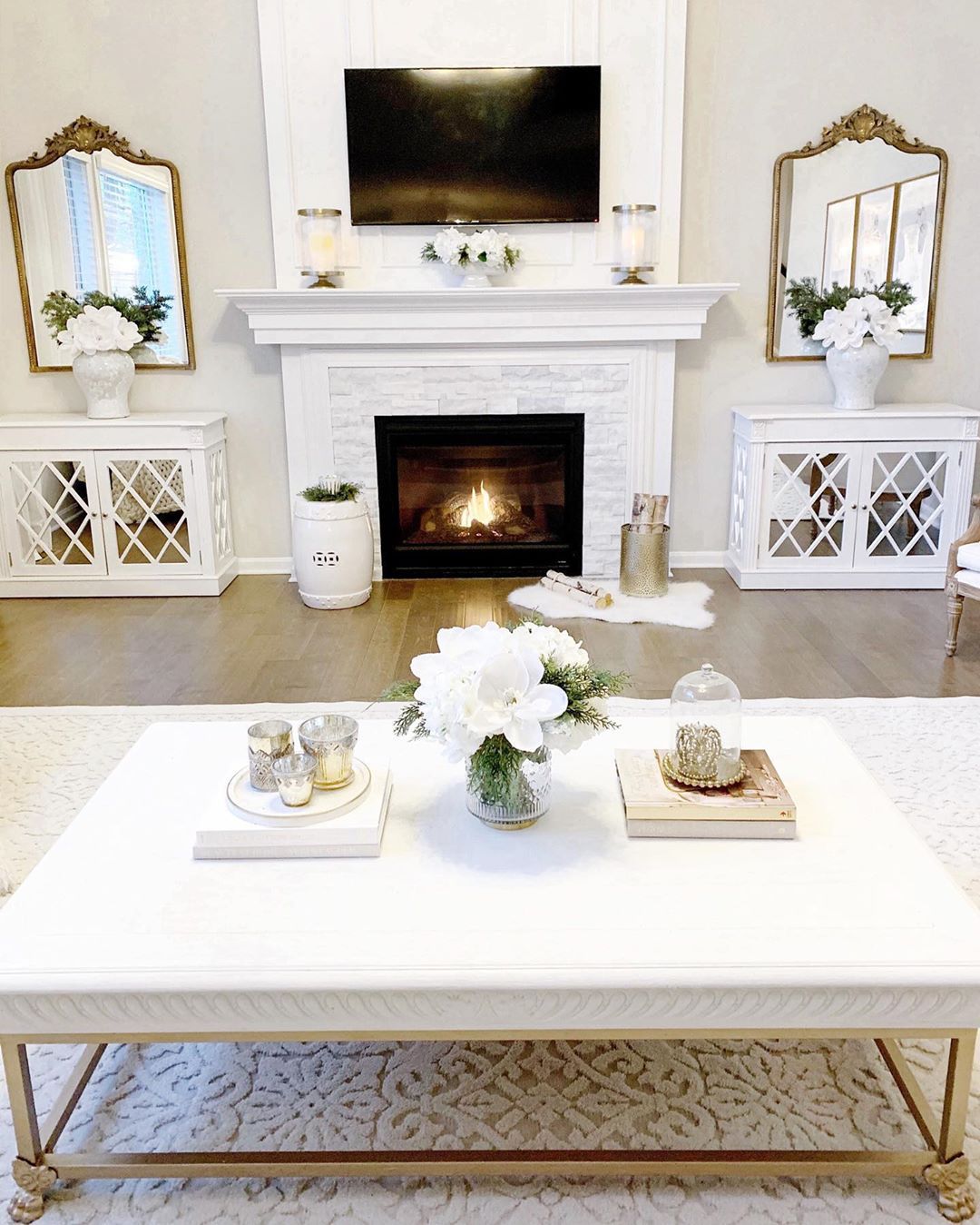 Glam Living Room with Matching Gold Mirrors Around Fireplace via @kathrynpackard