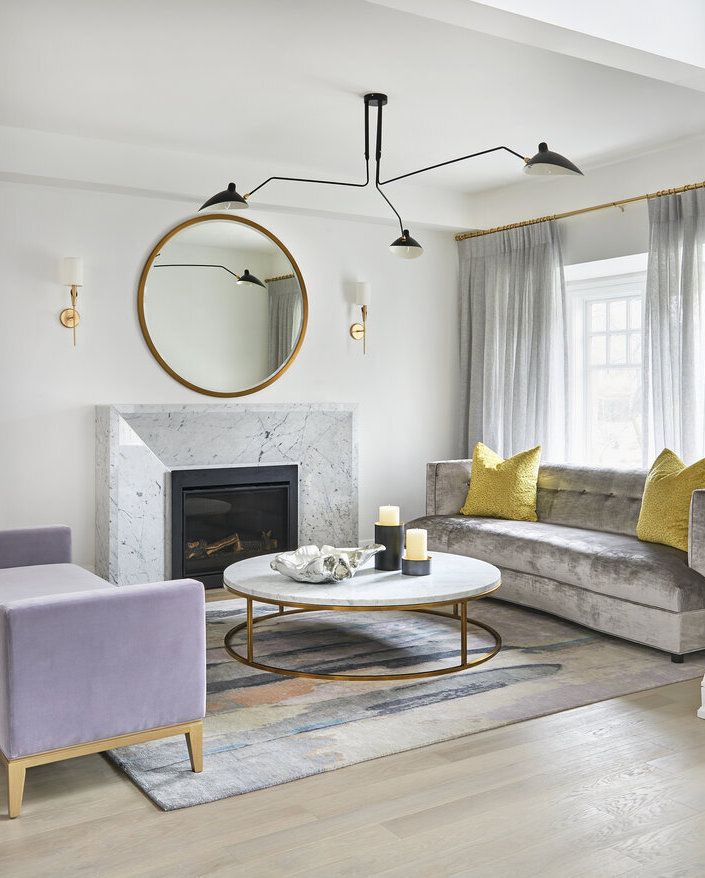 Glam Living Room with Round Marble Coffee Table via Ali Budd Interiors