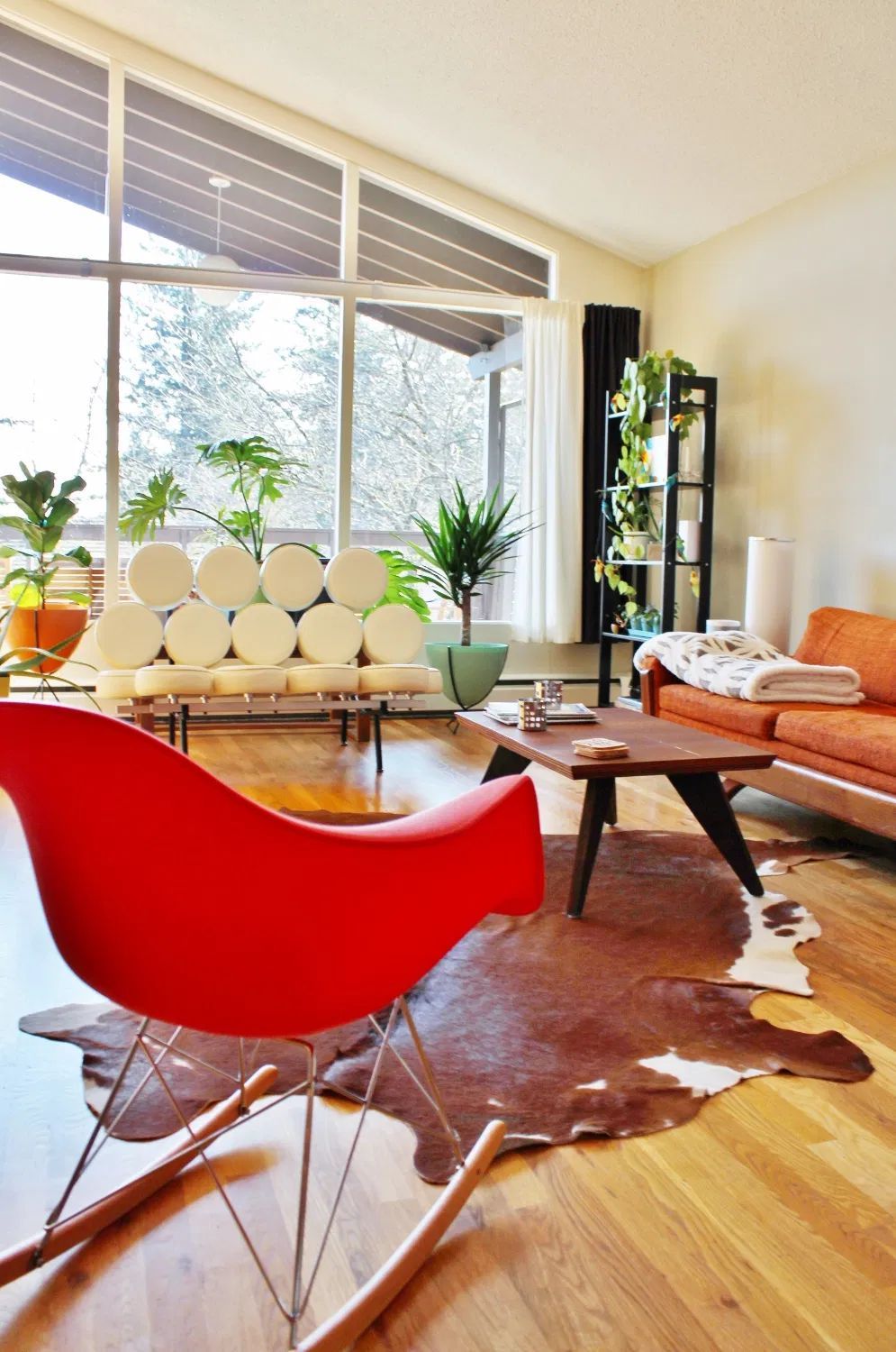 Mid-Century Modern Living Room with Eames Rocker Chair via hammerandaheadband