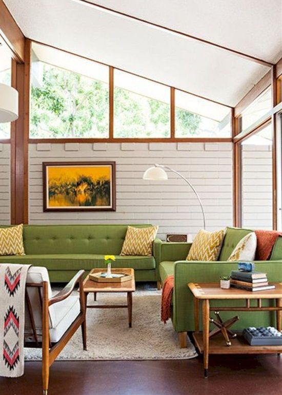 Mid-Century Modern Living Room with Slanted Ceiling and Green Sofas