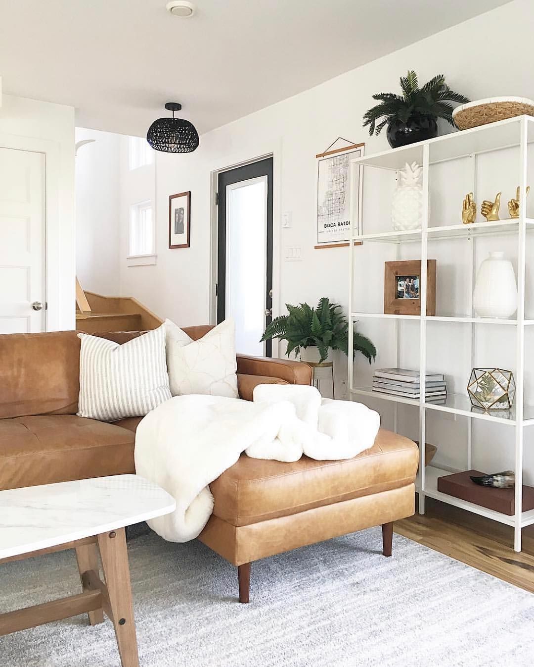 Neutral Living Room Decor with Brown leather Sectional Sofa via @theressnowplacelikehome