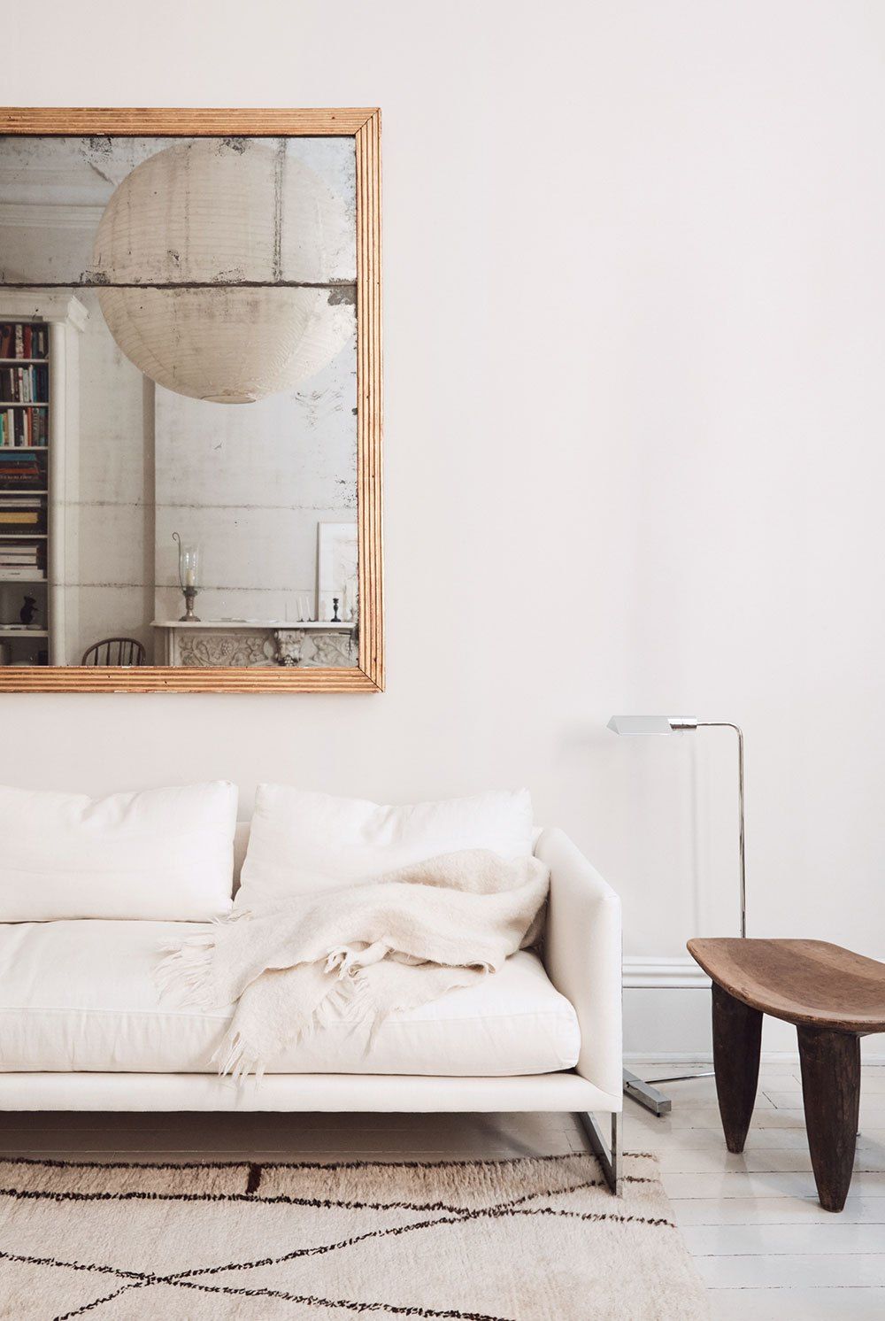 Neutral Living Room with Antique Gold Wall Mirror via Tom Delavan