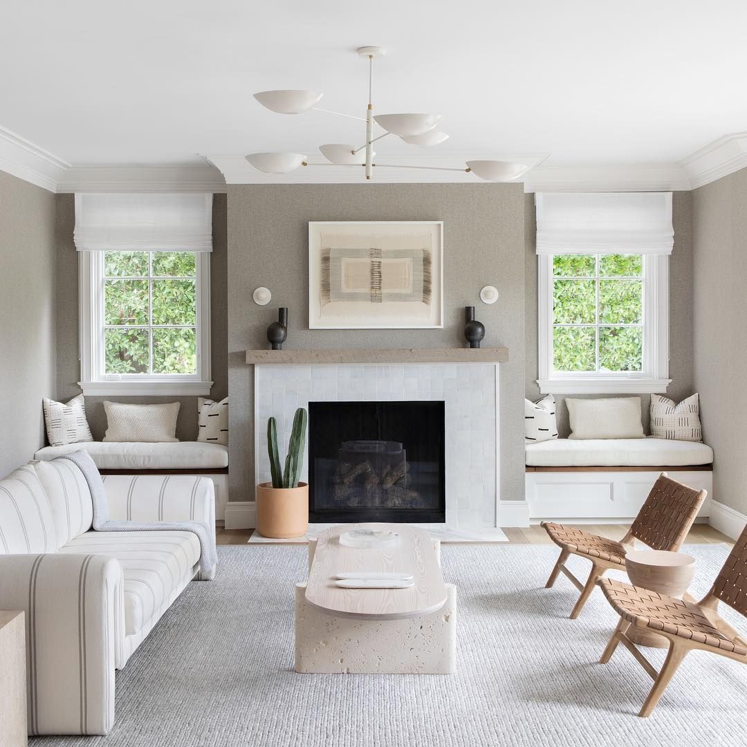 Neutral Living Room with Twin Woven Leather Accent Chairs @changoandco