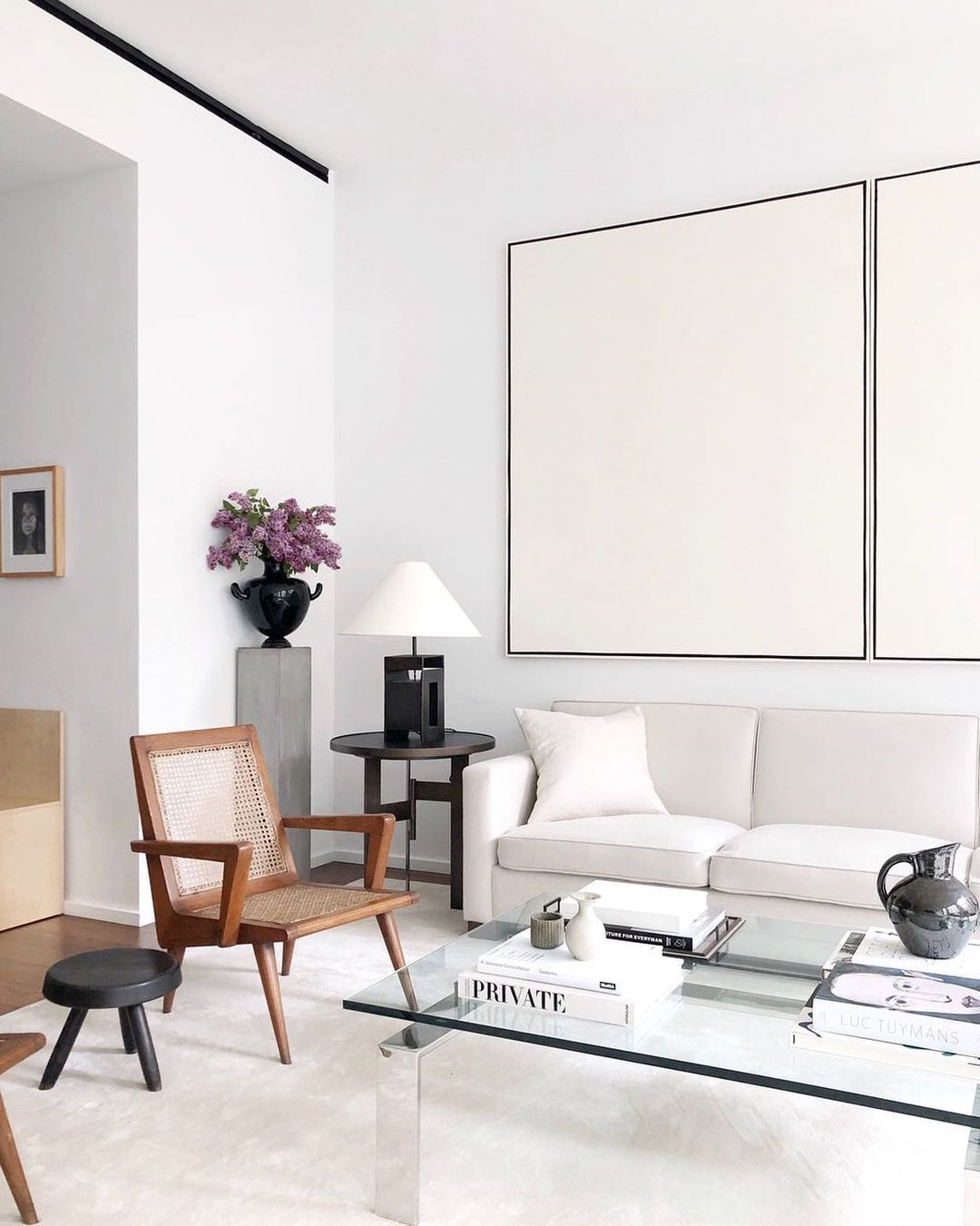 Neutral Living Room with Wood Cane Accent Chairs via @alyssakapitointeriors