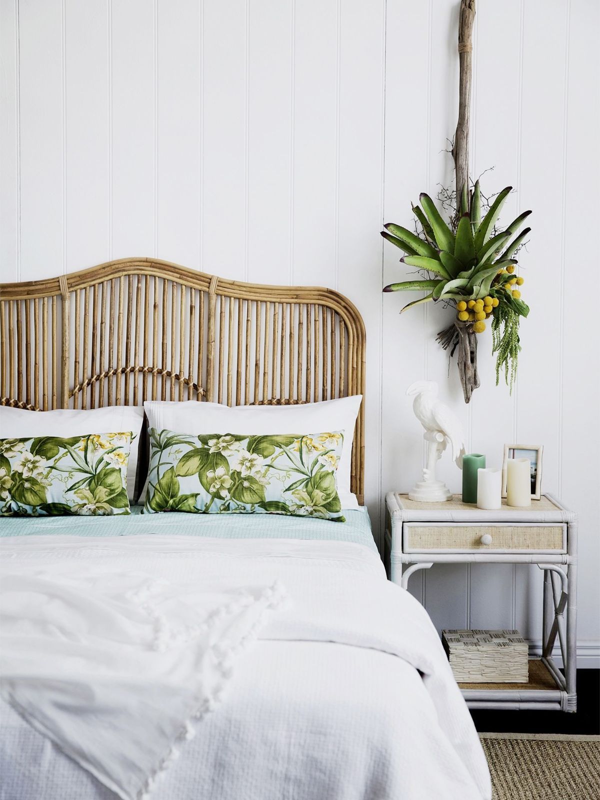 Rattan Furniture Tropical Decor - Bedroom with Rattan Headboard and Palm Leaf Pillows via homestolove.com.au