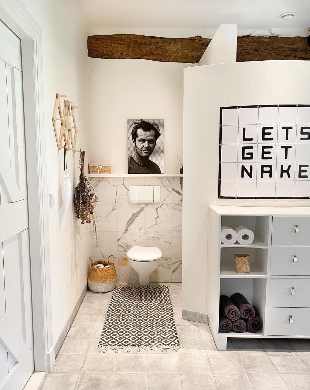 Scandinavian Bathroom with Seagrass Basket for Toilet Paper Rolls via @wonenop1