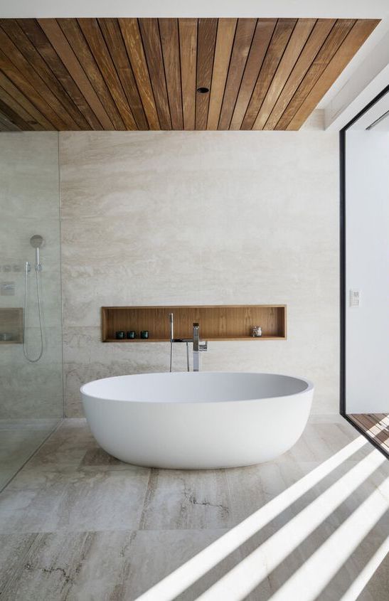 Scandinavian Bathroom with Wood Panel Ceiling and Recessed Shelf via ArchDaily
