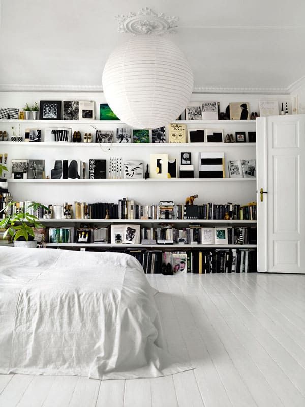 Scandinavian Bedroom with Bookshelves Lining the Wall