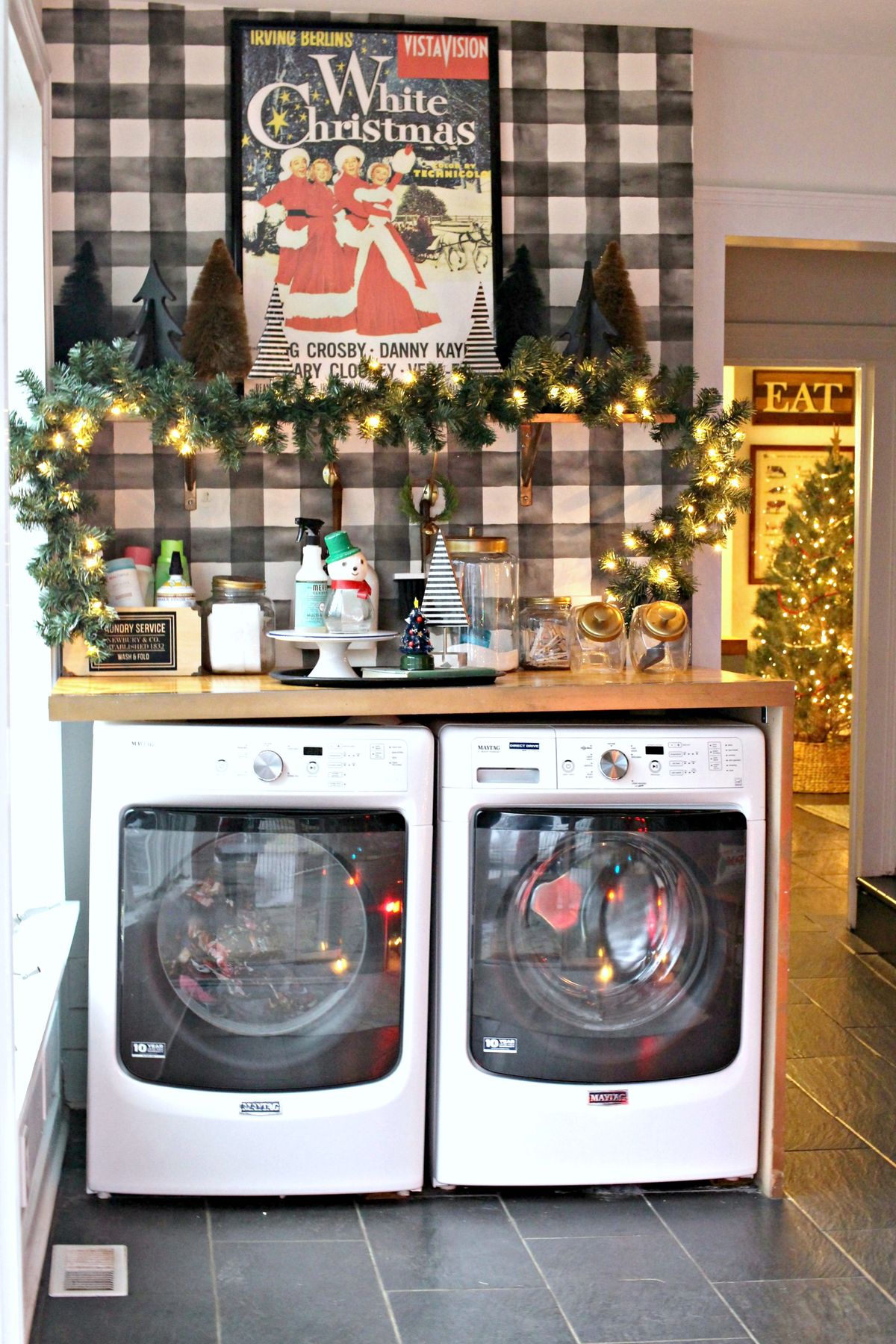 Christmas Laundry Room with Evergreen Garland Decor via gatheredky