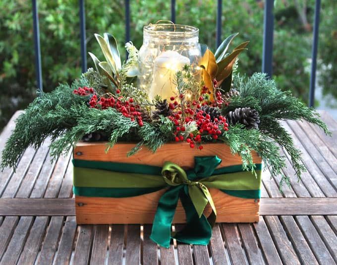 DIY Christmas Centerpiece with White Candle and Green Ribbons via apieceofrainbow