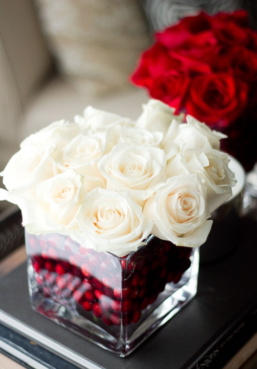 DIY Christmas Centerpieces - White Roses with Red Cranberries in a Glass Jar - via NotYourStandard