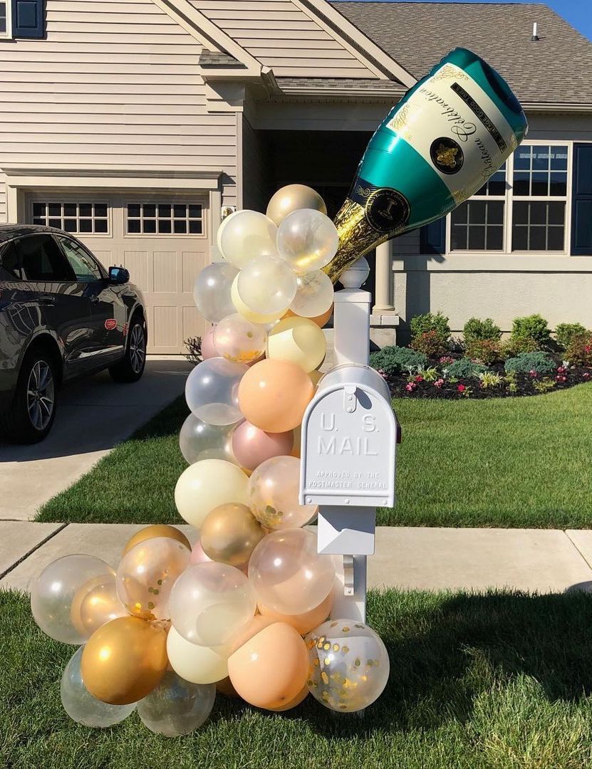 New Year's Eve Decor with Champagne Bubble Balloons on Mailbox Outside via @illianoevents