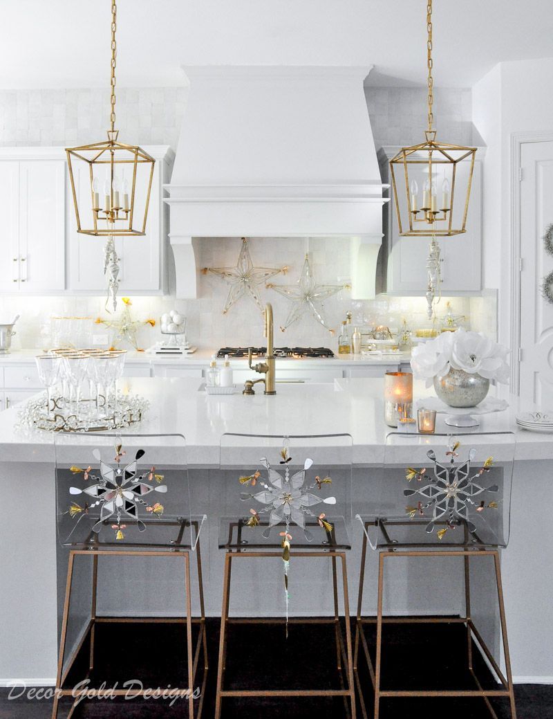 New Year's Eve Decor with Snowflakes on the Back of Counter Chairs and Gold Rimmed Champagne Glasses via DecorGoldDesigns