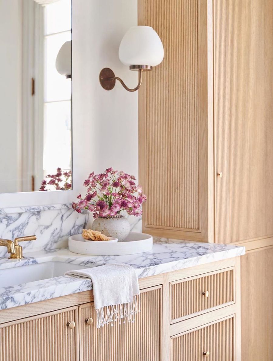 Beige Cabinets and Marble Countertops in Neutral Bathroom Decor via @amberinteriors