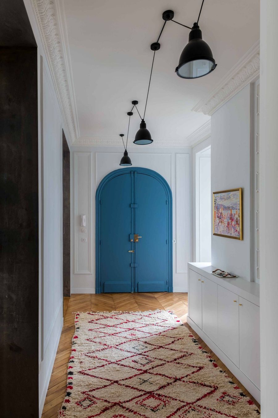 Blue Door in Paris Apartment Entryway via GCG Architectes