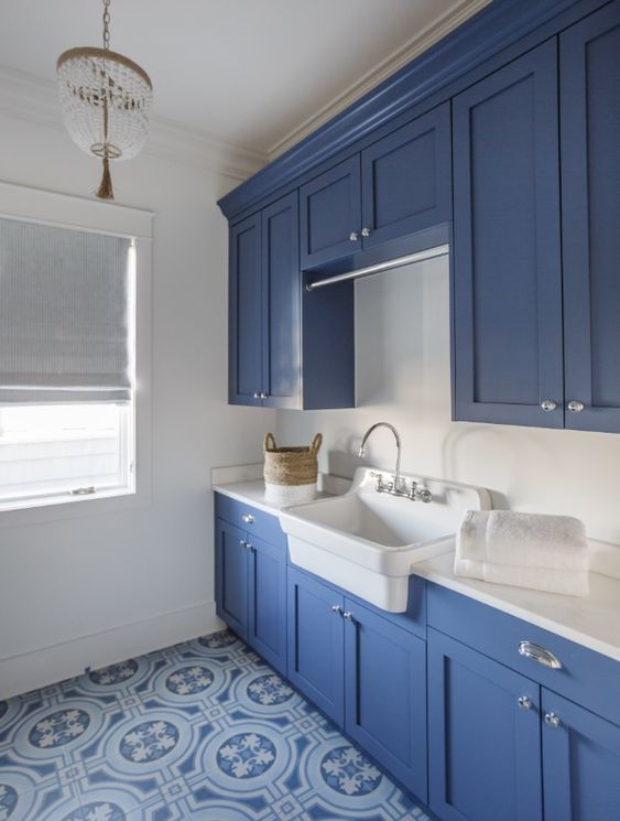 Blue Floor Tile in a Coastal Laundry Room via Lauren Leonard
