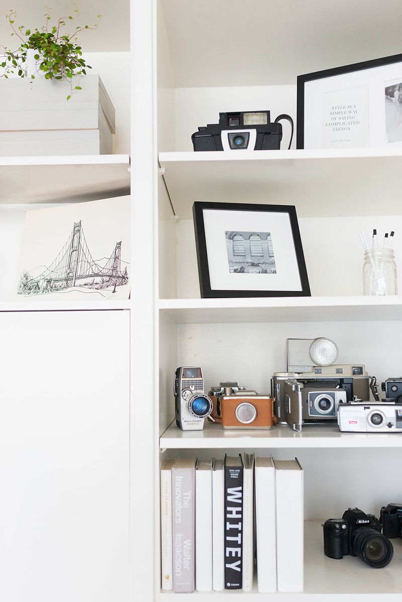 Cameras on a Home Bookshelf Styling via Hannah Pobar