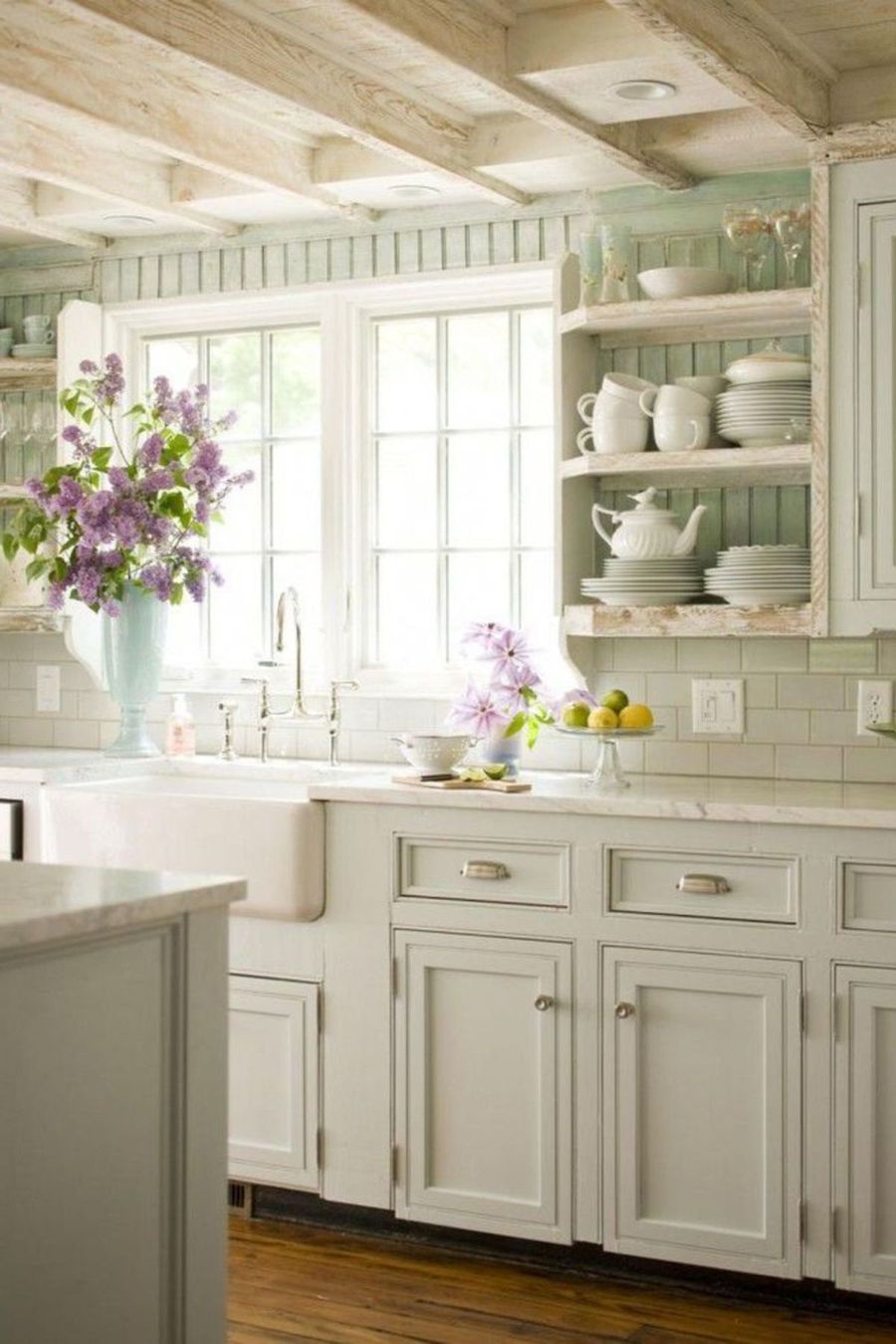 Creamy White Cabinets and Wood Beam ceiling in Country Kitchen