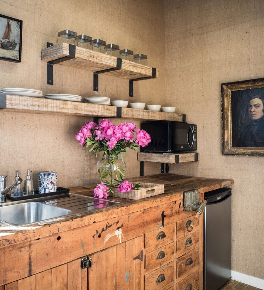 Distressed Wood Kitchen Cabinets in Country Kitchen via Antonio Martins Interior Design