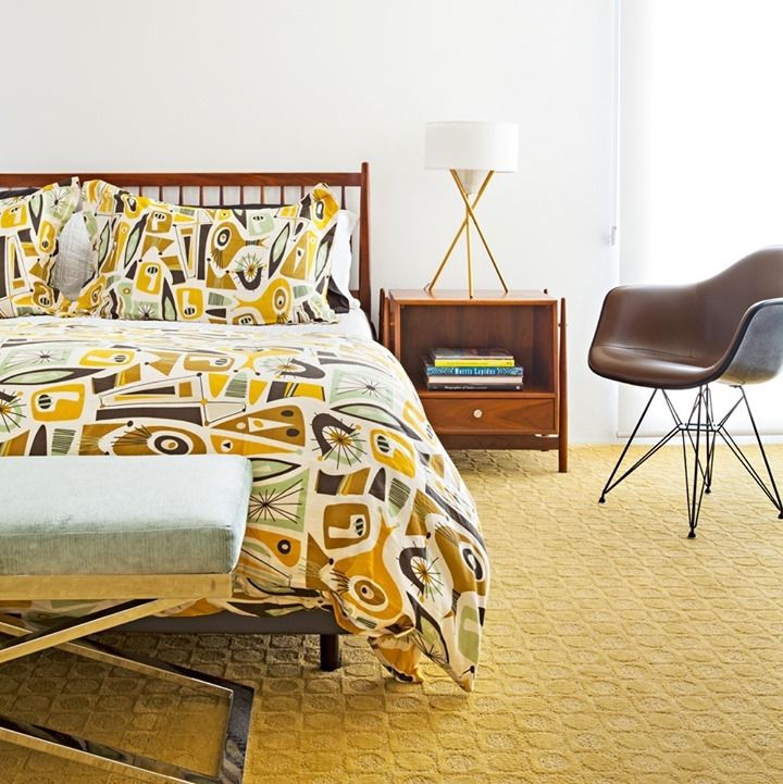 Eames Molded Plastic Armchair with Wire Base in Mid-Century Modern Bedroom with Mustard Yellow Rug via @theatomicranch
