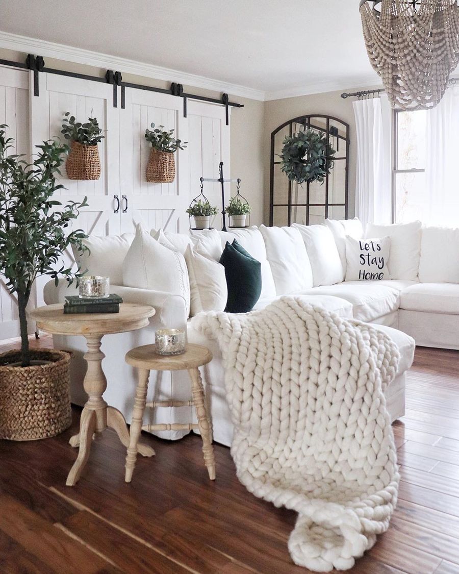 Farmhouse Living Room with Sliding Barn Doors via @randilynnblog