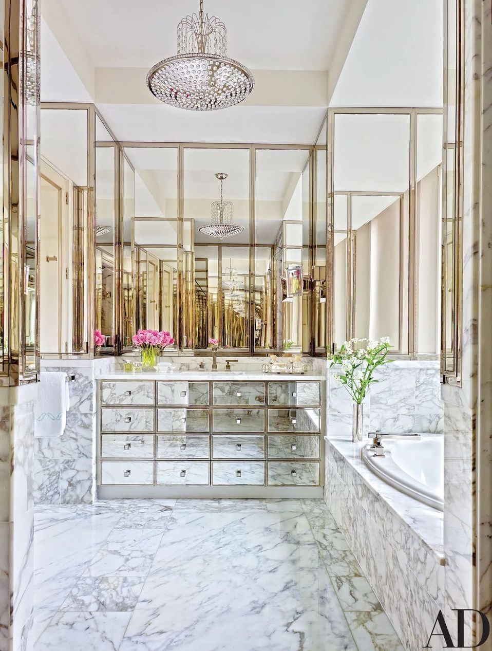 Glam Bathroom with Marble Floors, Walls, and Bathtub via AD