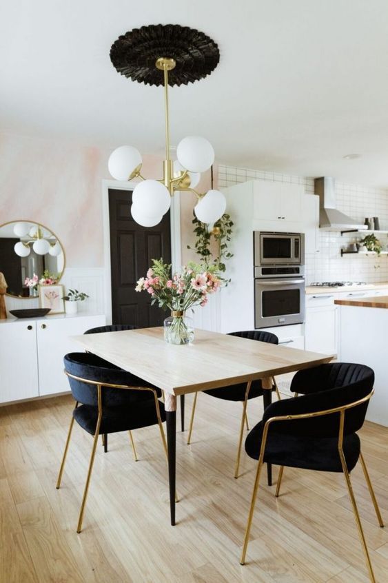 Glam Mid-Century Modern Dining Room Design with Black Side Chairs