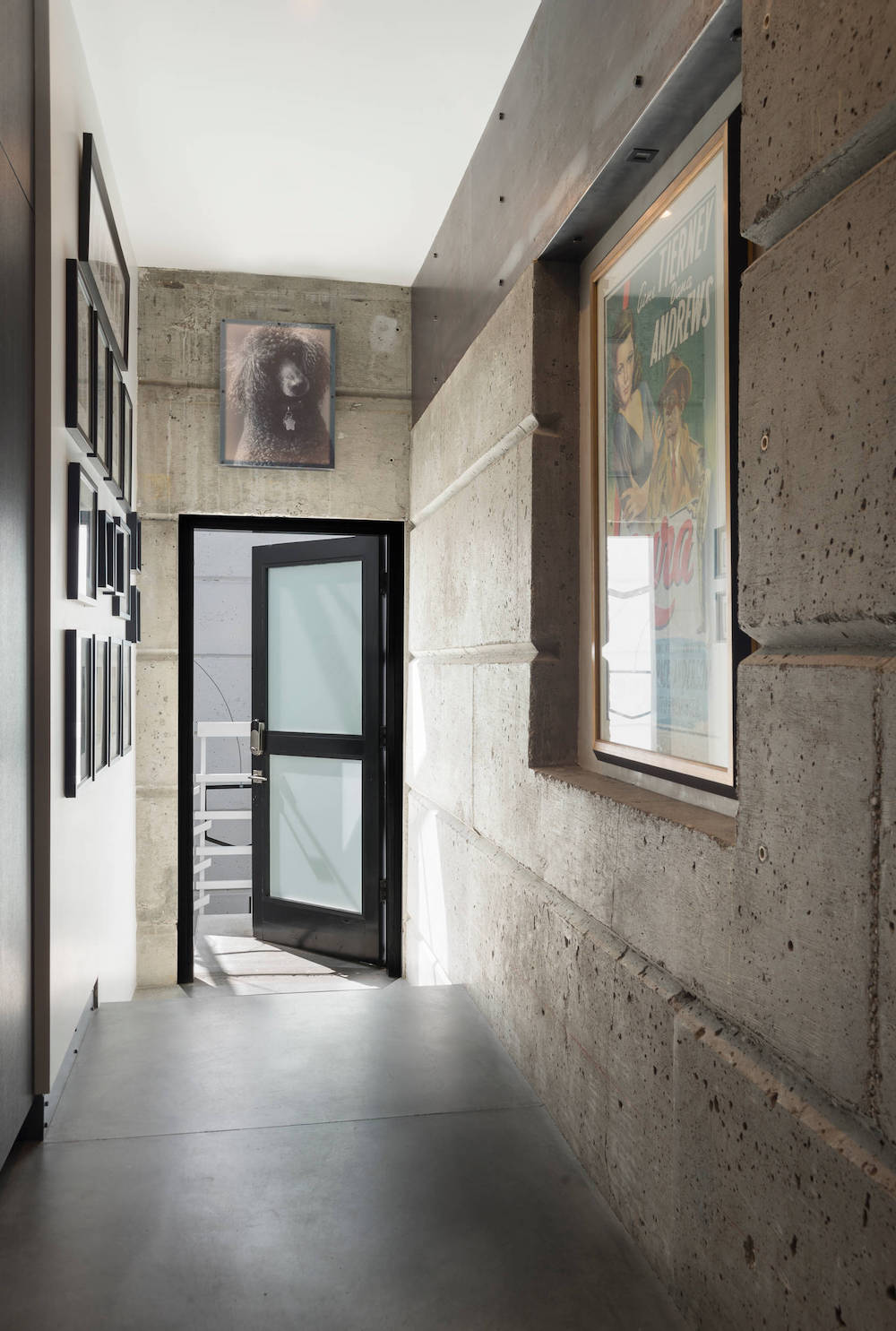 Industrial Entryway Design with Metal Floors and Concrete Walls via Gabe Border